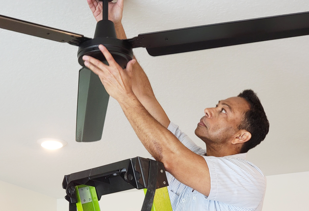 Del-Air electrician installing a fan