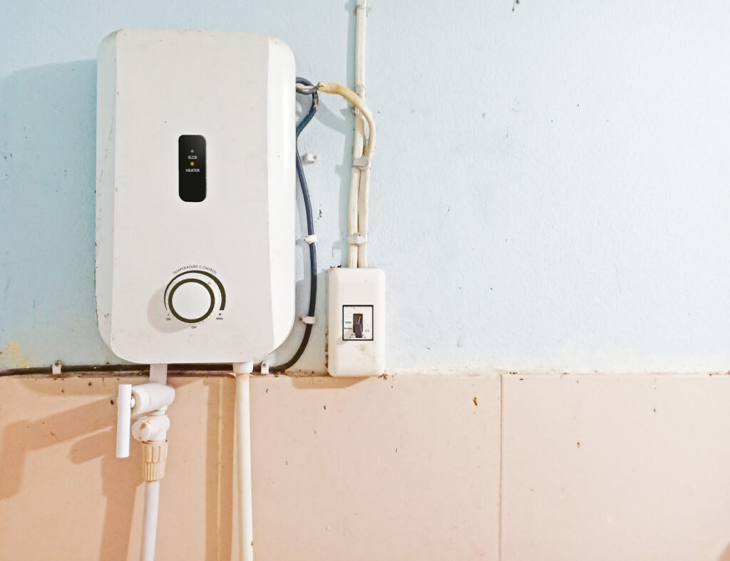 A new tankless water heater installed on a wall.