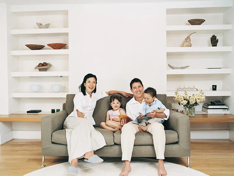 A happy family on a living room couch