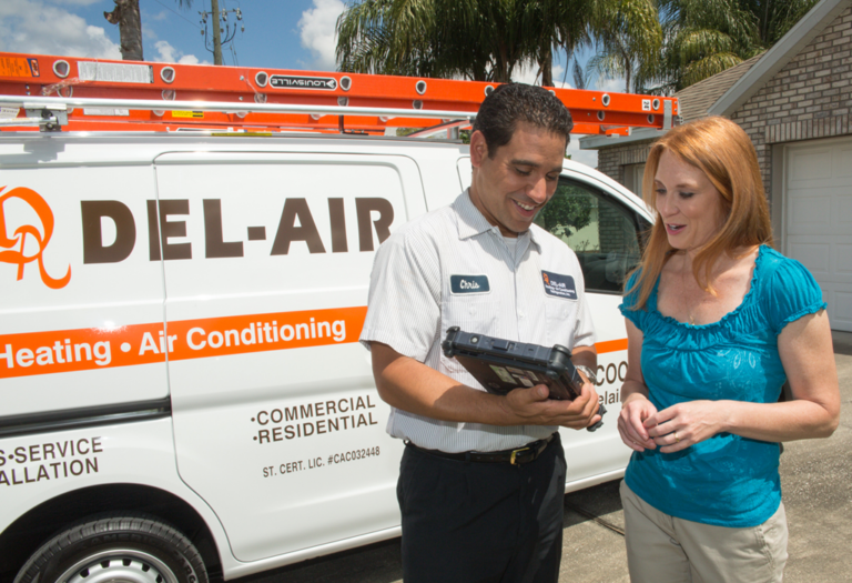 Del-Air technician working with a customer