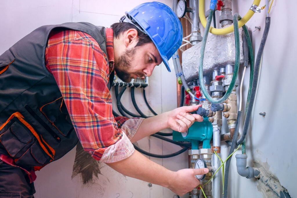 Technician installing heating system