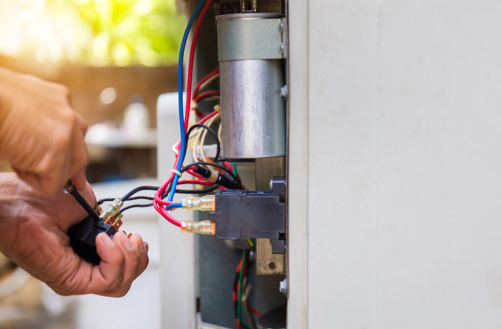 Close up of air conditioning repair, repairman fixing air conditioning system, changing magnetic contactor